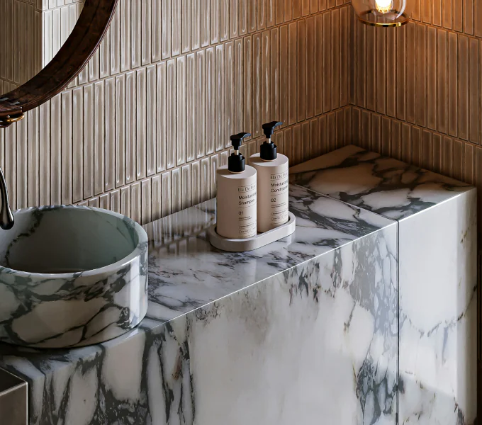 Modern bathroom design with marble sink, textured tile backsplash, and elegant lighting