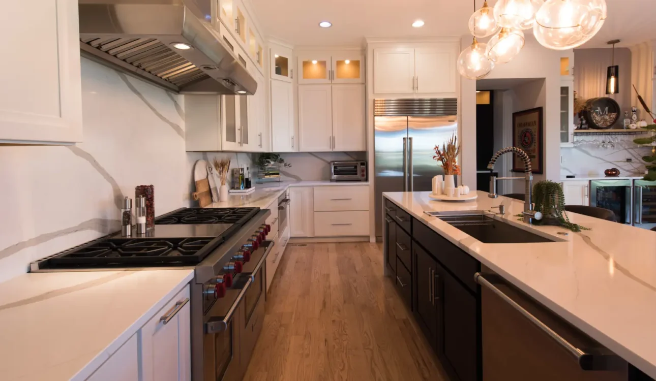 Why Your Denver Remodel Costs More Than Your Cousin’s in Phoenix (And What You Can Actually Control) 1 Luxury modern kitchen remodel featuring white cabinets, premium countertops and upscale appliances in Denver, highlighting factors that influence Denver remodeling costs