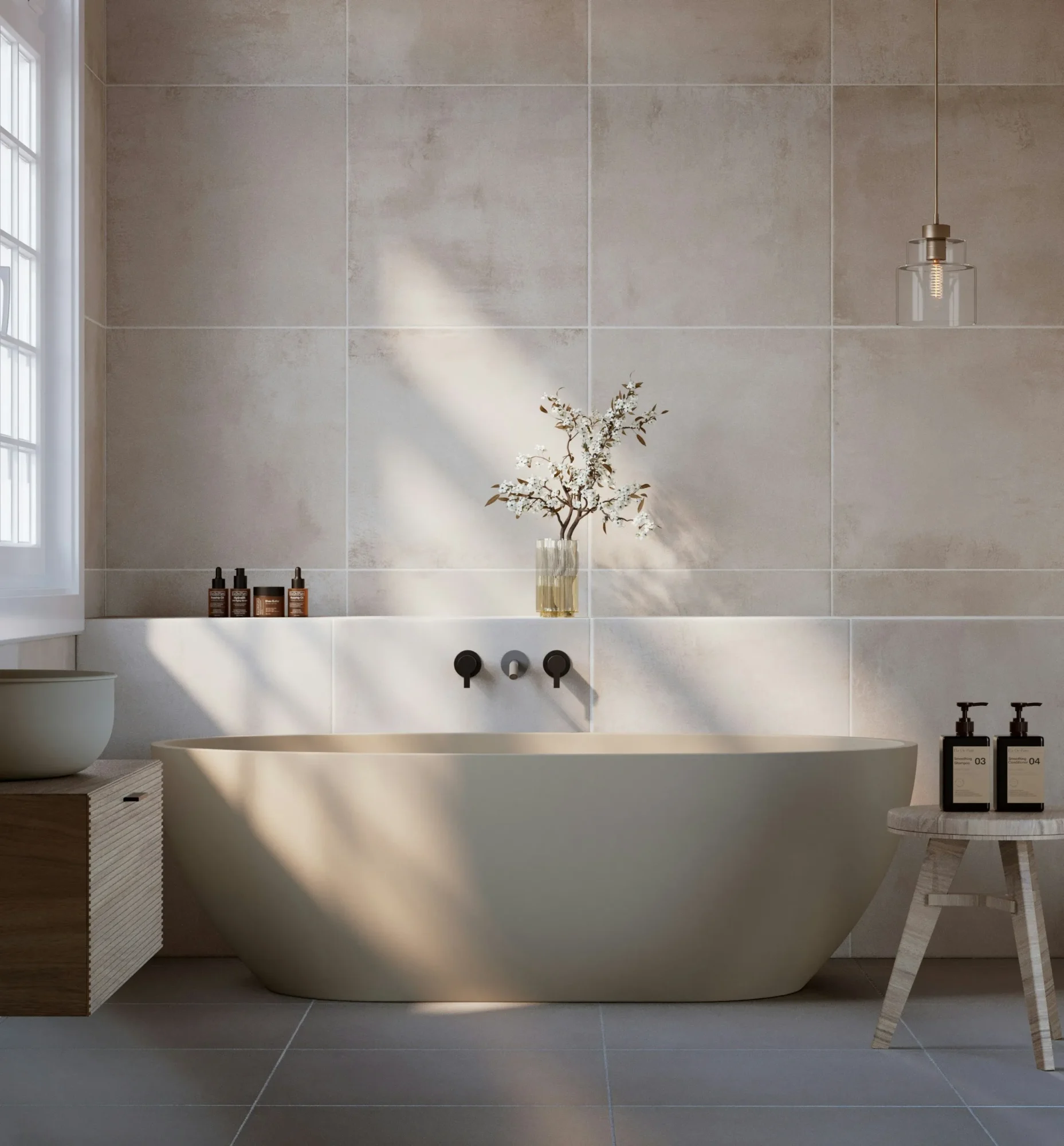 Minimalist freestanding soaking tub with neutral tile walls and soft natural light