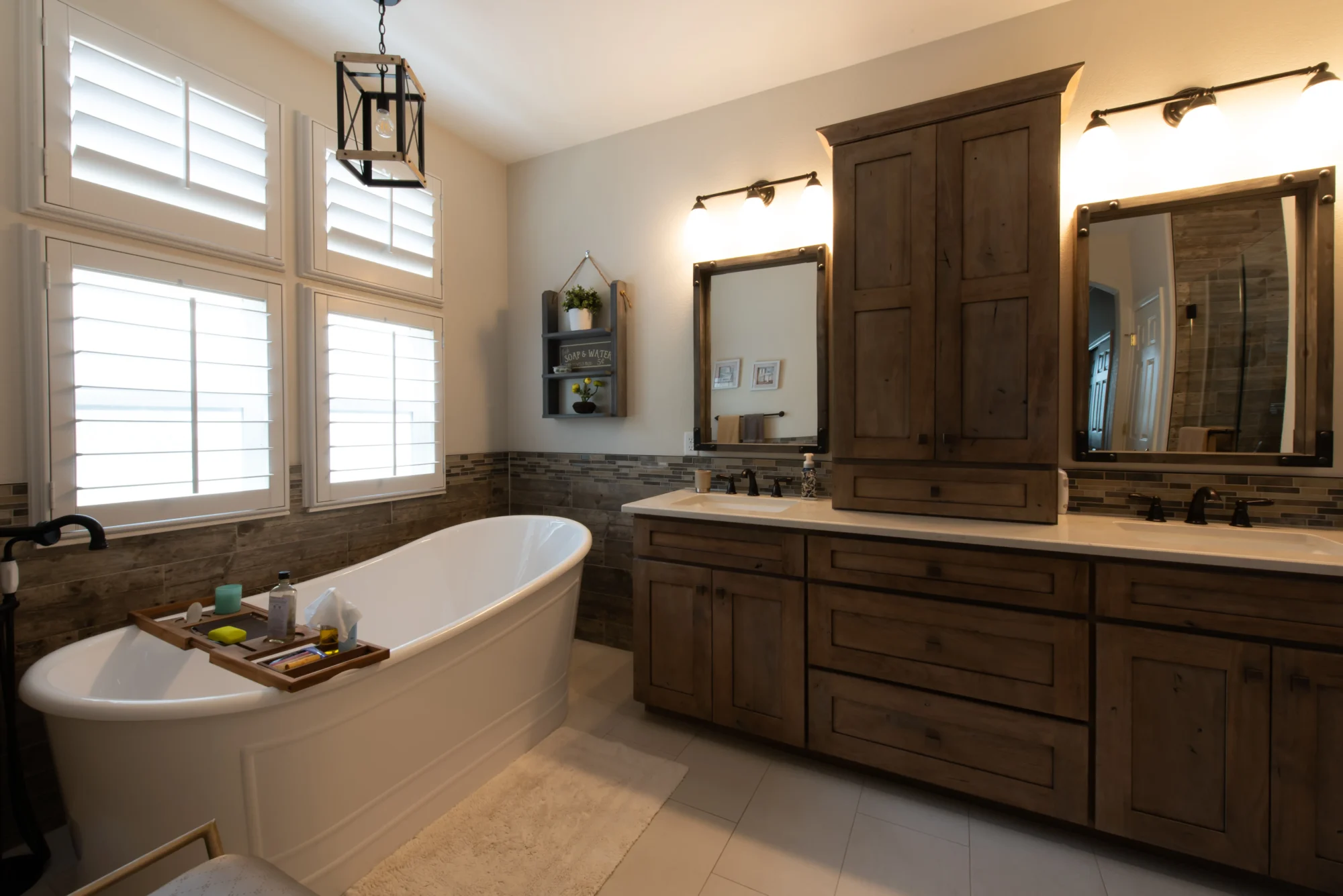 Rustic spa bathroom with freestanding tub and wood vanity