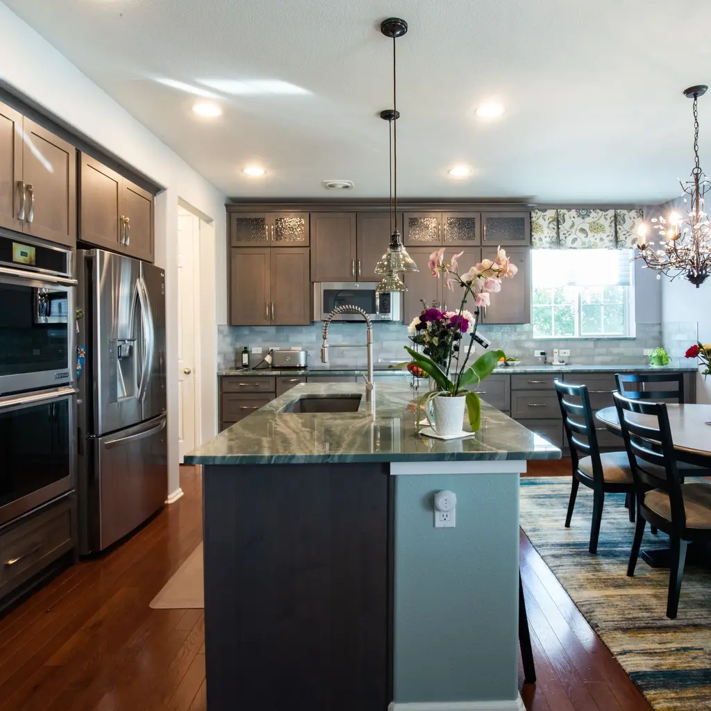 The Best Kitchen Storage Ideas for Denver Homeowners in 2026 9 open concept kitchen dark wood cabinets island