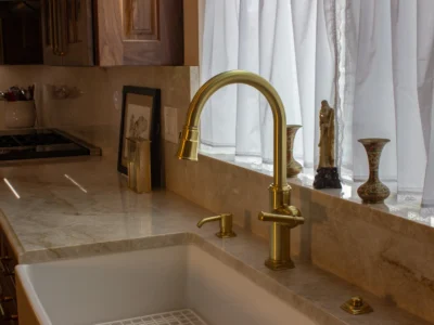 Burnished Grain Kitchen 14 farmhouse-sink-brushed-gold-faucet-marble-countertop-backsplash