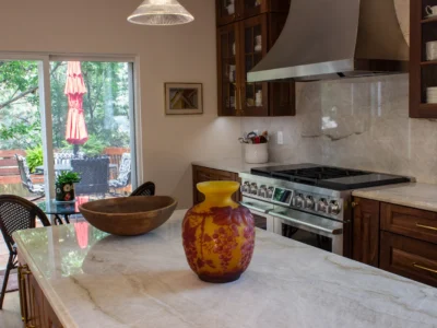 Burnished Grain Kitchen 12 Elite Cabinetry and Granite Burnished Grain Kitchen marble countertop island with amber vase and patio view