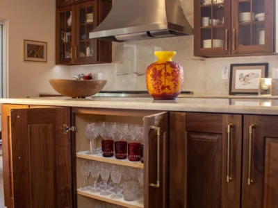 Burnished Grain Kitchen 11 Custom walnut cabinetry by Elite Cabinetry and Granite reveals thoughtfully designed crystal wine glass storage in the Burnished Grain Kitchen, showcasing the craftsmanship behind every detail of this Denver kitchen remodel.