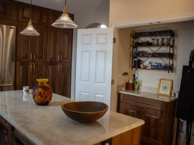 Burnished Grain Kitchen 10 Burnished Grain Kitchen marble island with walnut pantry cabinets and butler pantry nook