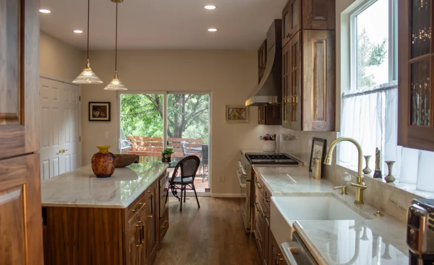 Burnished Grain Kitchen remodel overview with walnut island, farmhouse sink, and pendant lights