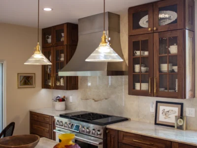 Burnished Grain Kitchen 2 walnut-kitchen-cabinets-stainless-range-hood-pendant-lights