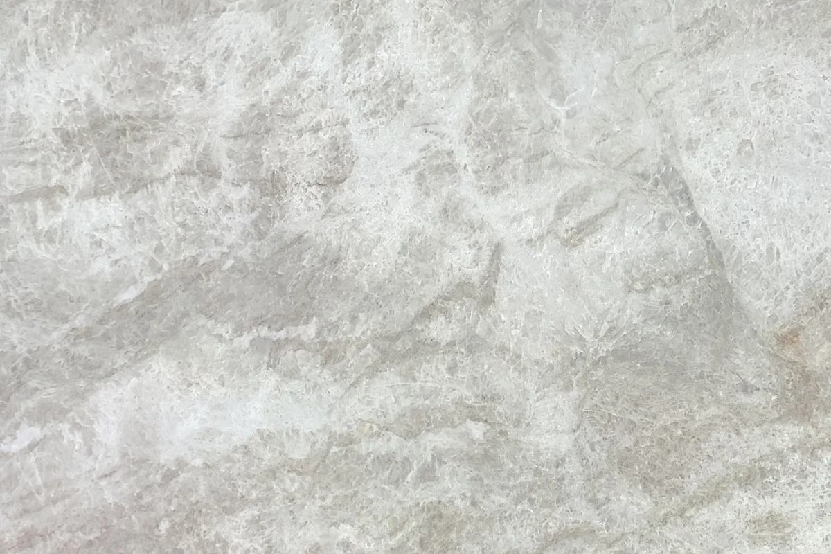 Leathered Quartzite Countertops: Cleaning, Sealing, and What to Check Before Buying 2 Close-up of leathered quartzite countertops showing pale veining and surface texture